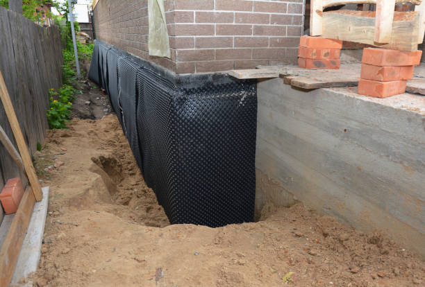 Happy homeowners after waterproofing job in Kewaunee